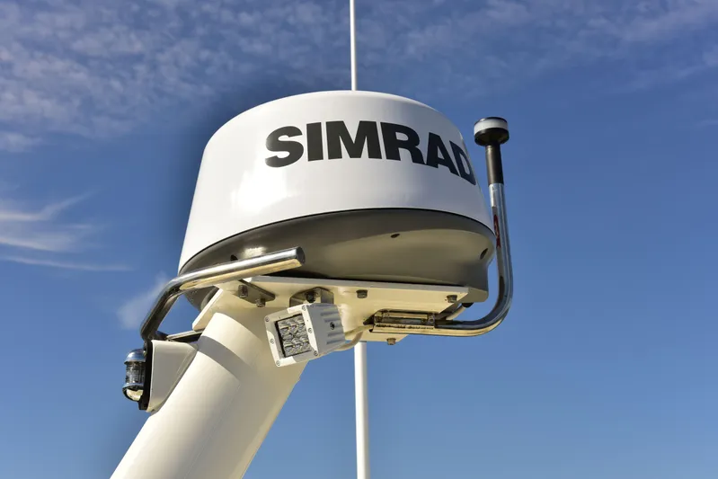 About Time Yacht Photos Pics Simrad radar on 1998 Duffy 35 Downeast Cruiser against blue sky.
