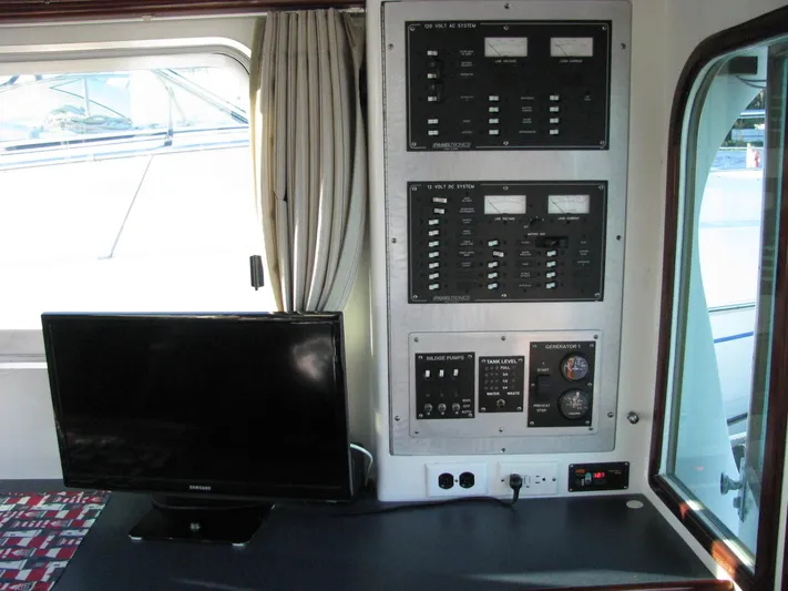About Time Yacht Photos Pics Control panel and monitor inside 1998 Duffy 35 Downeast Cruiser boat cabin.