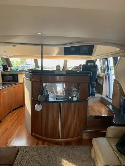  Yacht Photos Pics Interior of 1999 Carver 450 Voyager yacht with modern amenities and wooden finishes.