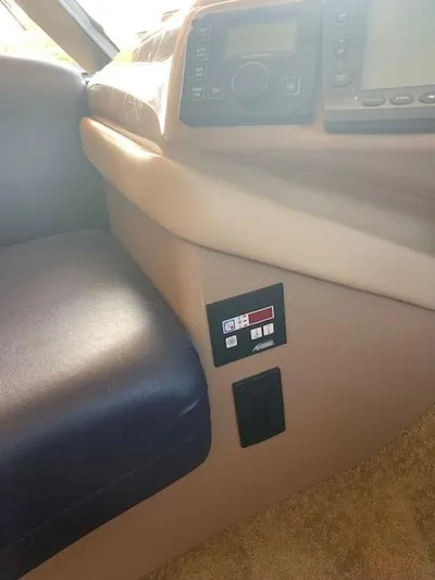  Yacht Photos Pics 1999 Carver 450 Voyager interior dashboard with control panel and seating.