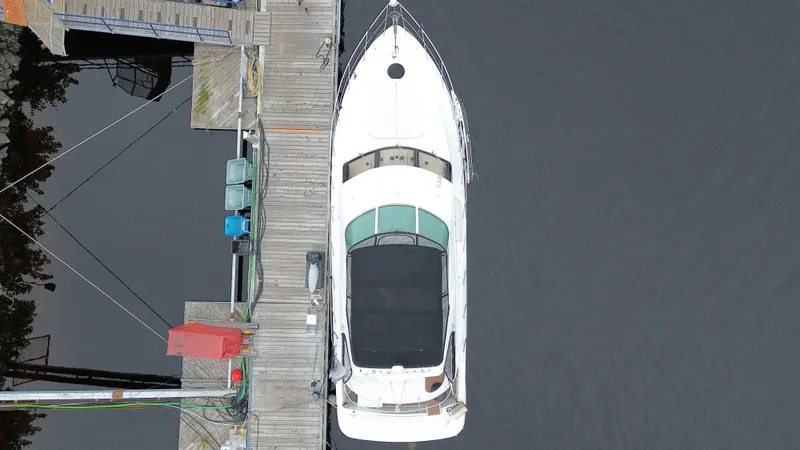  Yacht Photos Pics Overhead view of a 1999 Carver 450 Voyager yacht docked at a marina.