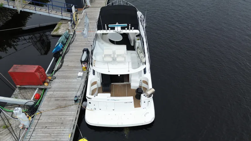  Yacht Photos Pics 1999 Carver 450 Voyager yacht docked at a marina, aerial view.