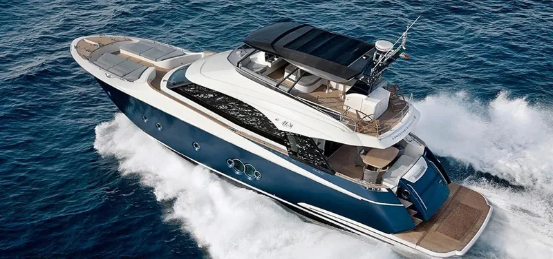  Yacht Photos Pics Monte Carlo Yachts MCY 65, 2013 model, cruising on open water.
