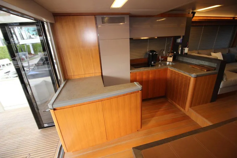  Yacht Photos Pics Luxurious interior of 2013 Monte Carlo Yachts MCY 65 with modern kitchen design.