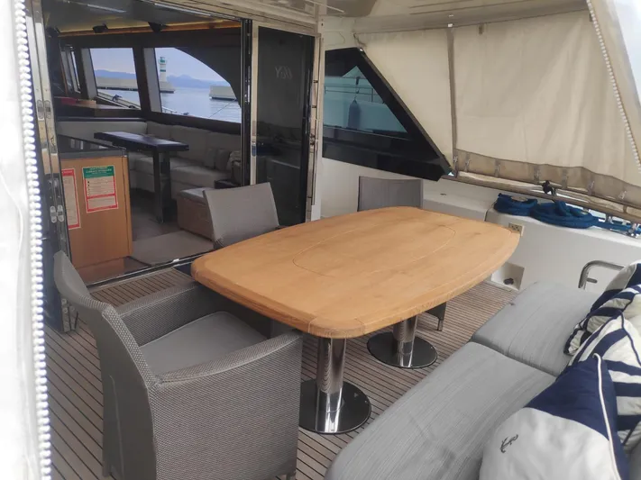  Yacht Photos Pics Luxurious 2013 Monte Carlo Yachts MCY 65 interior with elegant dining area and ocean view.