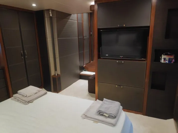  Yacht Photos Pics Luxurious interior of 2013 Monte Carlo Yachts MCY 65 with modern furnishings and TV.