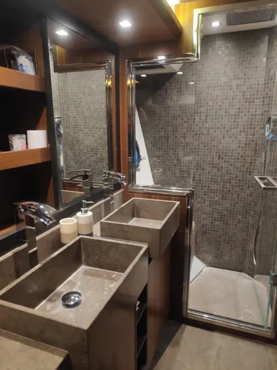  Yacht Photos Pics Luxurious bathroom in 2013 Monte Carlo Yachts MCY 65 with modern fixtures and elegant design.