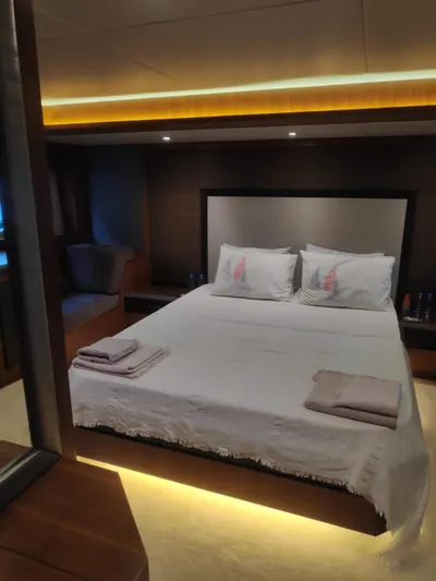  Yacht Photos Pics Luxurious bedroom interior of 2013 Monte Carlo Yachts MCY 65 with elegant lighting and cozy bedding.