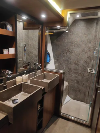  Yacht Photos Pics Luxurious bathroom in 2013 Monte Carlo Yachts MCY 65 with modern fixtures and elegant design.