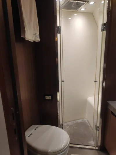  Yacht Photos Pics Luxurious bathroom in 2013 Monte Carlo Yachts MCY 65 with modern shower and toilet.