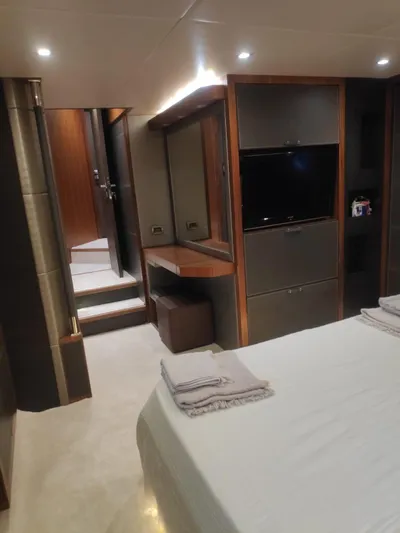  Yacht Photos Pics Luxurious cabin interior of 2013 Monte Carlo Yachts MCY 65 with modern amenities.
