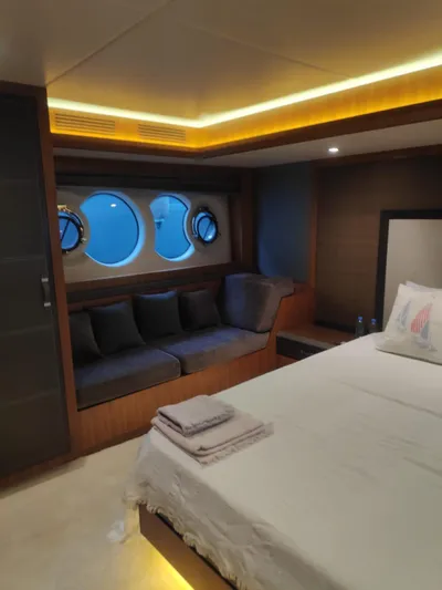  Yacht Photos Pics Luxurious cabin interior of 2013 Monte Carlo Yachts MCY 65 with cozy seating and ambient lighting.