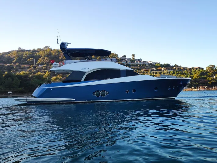  Yacht Photos Pics 2013 Monte Carlo Yachts MCY 65 in serene waters, showcasing elegant design and luxury.