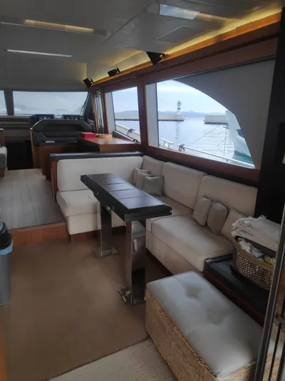  Yacht Photos Pics Luxurious interior of 2013 Monte Carlo Yachts MCY 65 with elegant seating and ocean view.