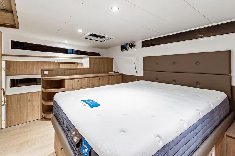 Innforapenny III Yacht Photos Pics Luxurious bedroom interior of 2020 PowerPlay Catamarans Longreach 1900 Expedition with modern design.