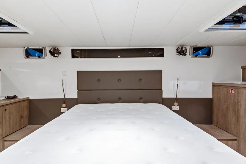 Innforapenny III Yacht Photos Pics Luxurious bedroom interior of 2020 PowerPlay Catamarans Longreach 1900 Expedition yacht.