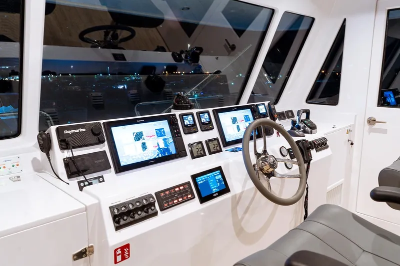 Innforapenny III Yacht Photos Pics Cockpit of 2020 PowerPlay Catamarans Longreach 1900 Expedition with advanced navigation systems.