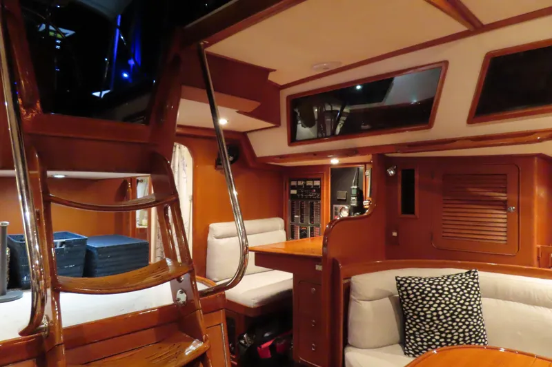 Sea Pearl Yacht Photos Pics Interior of a 1998 Hylas 54' yacht with polished wood and cozy seating.