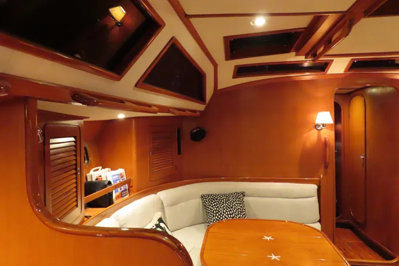 Sea Pearl Yacht Photos Pics Luxurious interior of a 1998 Hylas 54' yacht with elegant wood finishes.