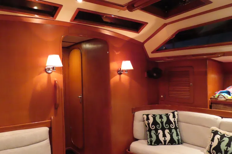 Sea Pearl Yacht Photos Pics Luxurious interior of a 1998 Hylas 54' yacht with elegant wood paneling.