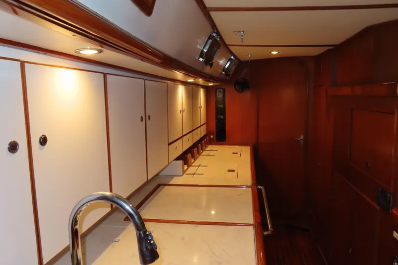 Sea Pearl Yacht Photos Pics Luxurious interior of a 1998 Hylas 54' yacht with wooden cabinetry and modern fixtures.