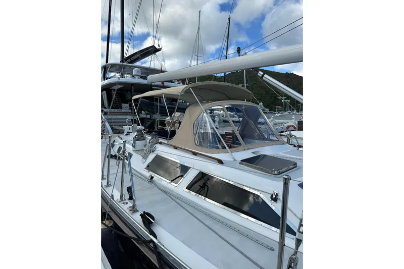 Sea Pearl Yacht Photos Pics 1998 Hylas 54' yacht with sleek design, docked under a cloudy sky.