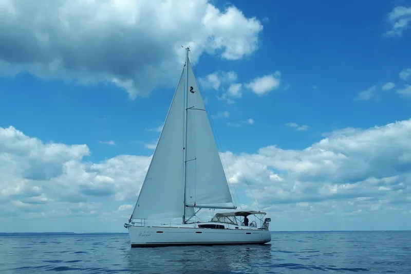 J'ouvert Yacht Photos Pics Sailing yacht Beneteau 43, 2009 model, on calm sea under blue sky.