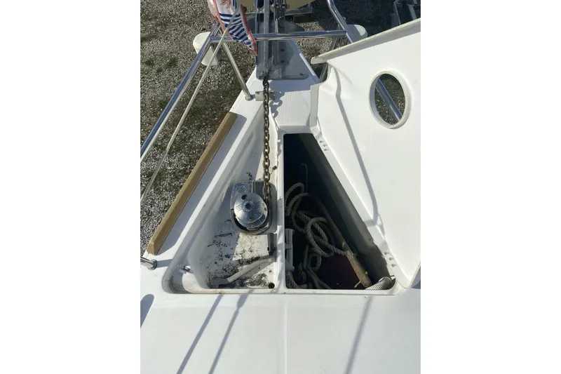 J'ouvert Yacht Photos Pics Bow of 2009 Beneteau 43 sailboat with anchor chain and storage compartment.