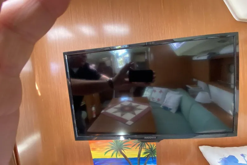 J'ouvert Yacht Photos Pics Interior of 2009 Beneteau 43 yacht with TV and cozy seating area.