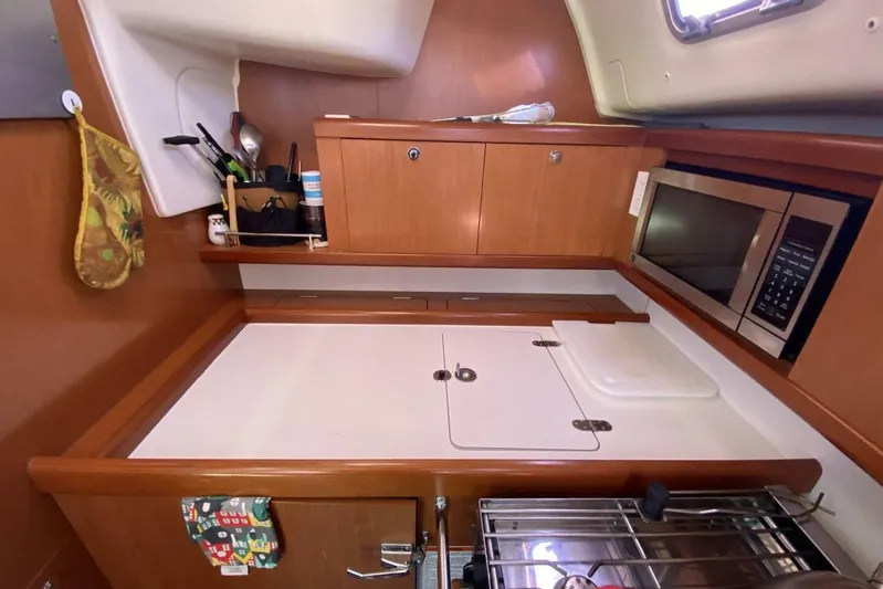 J'ouvert Yacht Photos Pics Galley kitchen in 2009 Beneteau 43 yacht with microwave and storage cabinets.