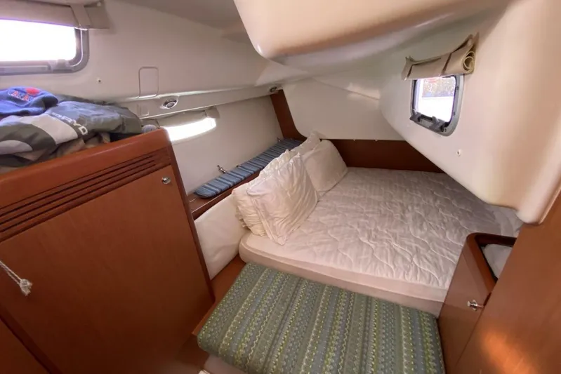 J'ouvert Yacht Photos Pics Cozy cabin interior of 2009 Beneteau 43 sailboat with bed and storage.