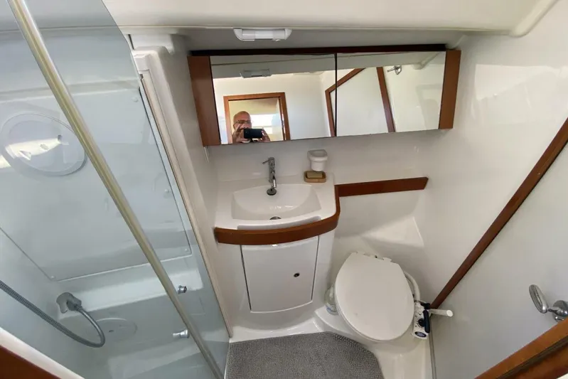 J'ouvert Yacht Photos Pics Bathroom interior of 2009 Beneteau 43 yacht, featuring sink, toilet, and shower.