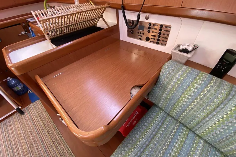 J'ouvert Yacht Photos Pics Interior of 2009 Beneteau 43 yacht with navigation station and seating area.