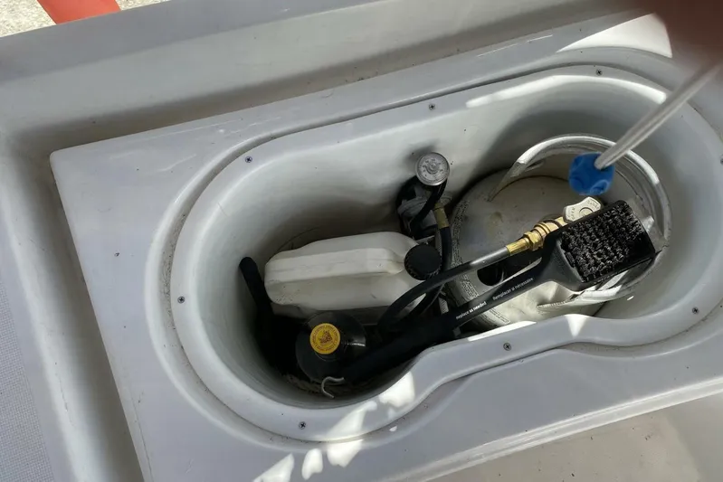 J'ouvert Yacht Photos Pics Storage compartment on a 2009 Beneteau 43 yacht, containing various equipment and tools.