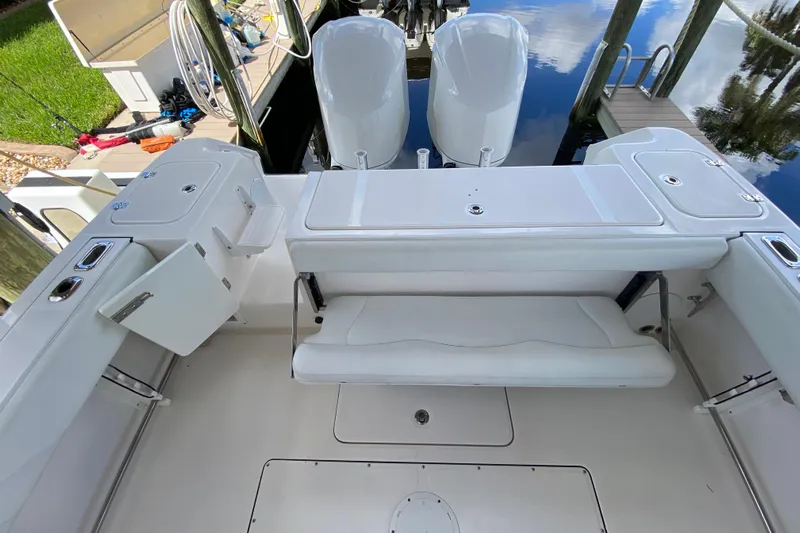 Pretty Fine Yacht Photos Pics 2015 Edgewater 320CC boat interior with seating and storage compartments.