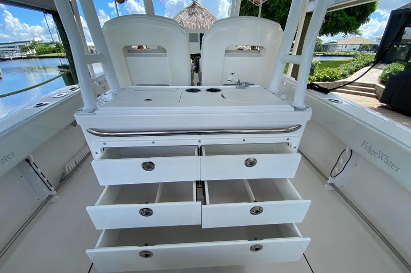 Pretty Fine Yacht Photos Pics 2015 Edgewater 320CC boat interior with open storage drawers and sink.