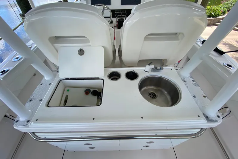 Pretty Fine Yacht Photos Pics Edgewater 320CC 2015 boat interior with sink and storage compartments.