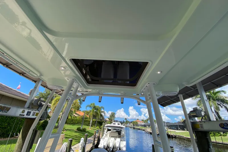 Pretty Fine Yacht Photos Pics 2015 Edgewater 320CC boat interior view with canal and palm trees in background.