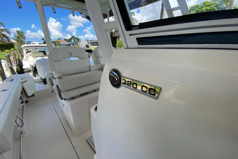 Pretty Fine Yacht Photos Pics 2015 Edgewater 320CC boat interior with seating and model emblem.