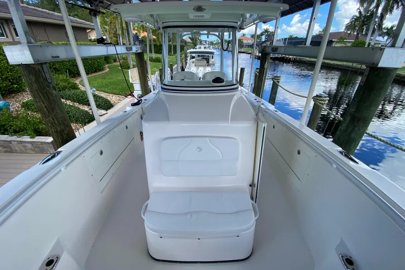Pretty Fine Yacht Photos Pics 2015 Edgewater 320CC boat interior, docked by a scenic canal.