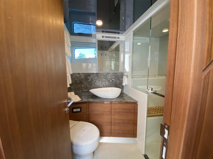 Clb72 Yacht Photos Pics Luxurious bathroom in 2023 CL Yachts CLB72, featuring modern fixtures and elegant wood finishes.