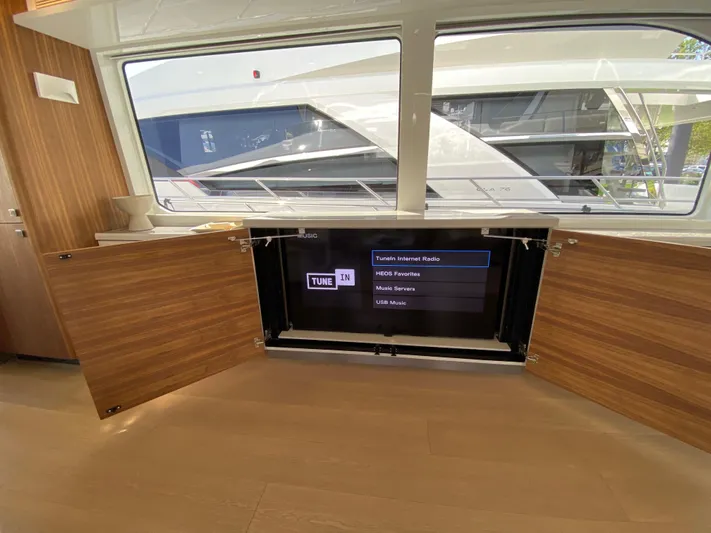 Clb72 Yacht Photos Pics Interior of 2023 CL Yachts CLB72 with hidden TV cabinet and large window view.