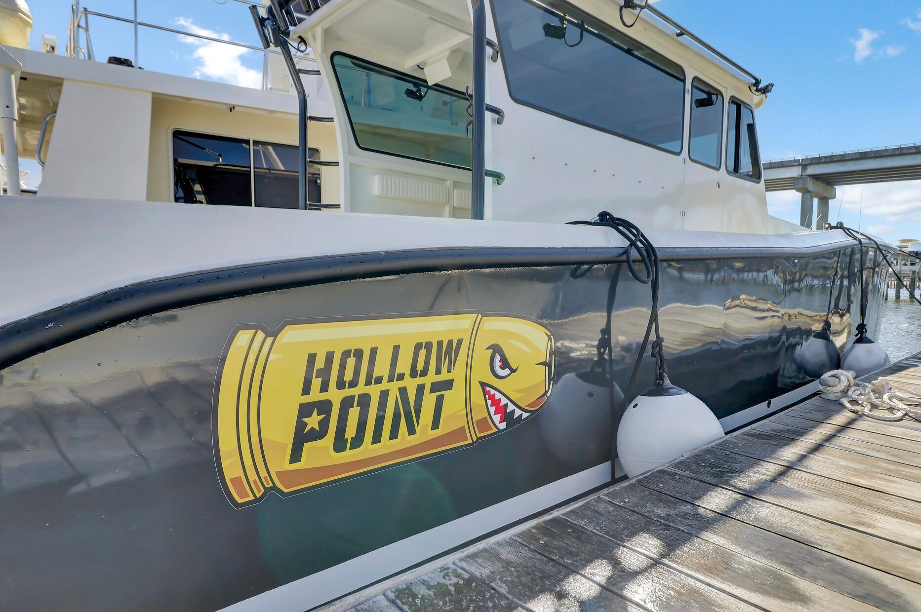 Custom Nerowalker 2024 boat docked, featuring "Hollow Point" logo on the side.