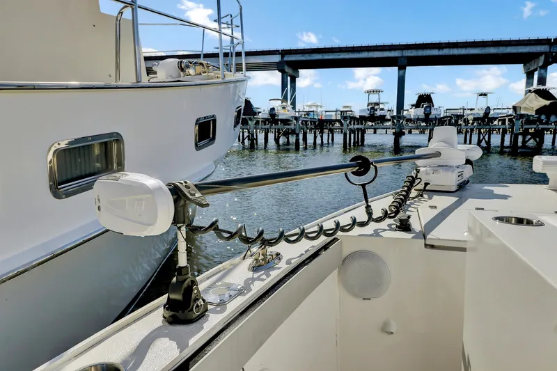 Our Trade Yacht Photos Pics 2024 Custom Nerowalker boat docked near a bridge, showcasing modern design and equipment.
