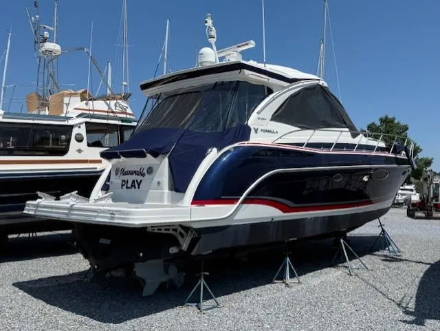  Yacht Photos Pics 2017 Formula 45 Yacht on stands, blue and white design, marina background.