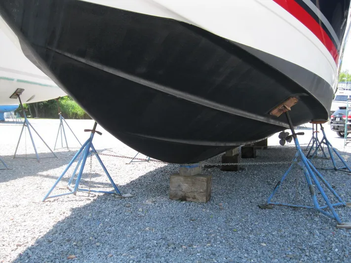  Yacht Photos Pics 2017 Formula 45 Yacht hull on stands, gravel surface, outdoor storage.