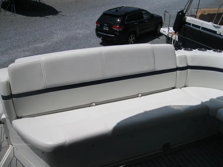  Yacht Photos Pics 2017 Formula 45 Yacht seating area with white upholstery and cup holders.