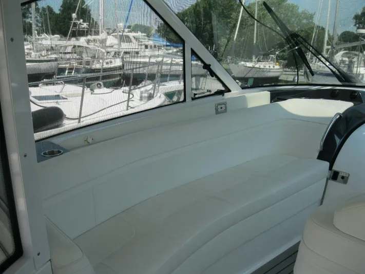  Yacht Photos Pics 2017 Formula 45 Yacht interior with white seating, docked at marina.