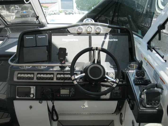  Yacht Photos Pics Cockpit of 2017 Formula 45 Yacht with Raymarine navigation systems and steering wheel.