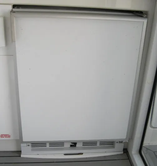  Yacht Photos Pics White panel on a 2017 Formula 45 Yacht, possibly a refrigerator or storage compartment.